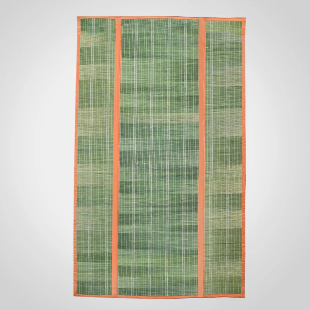 Darbha grass mat in three panels with orange cotton binding, laid flat