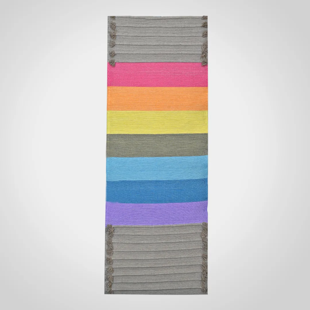 Prithvi chakra mat laid flat, seven colour bands on an earth-toned ground