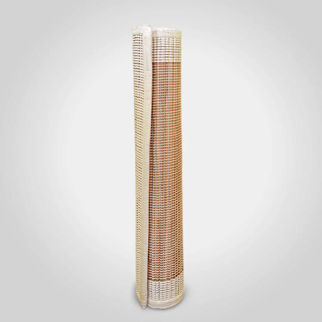Sambu Frame grass mat rolled and standing, showing the tan field and paler border